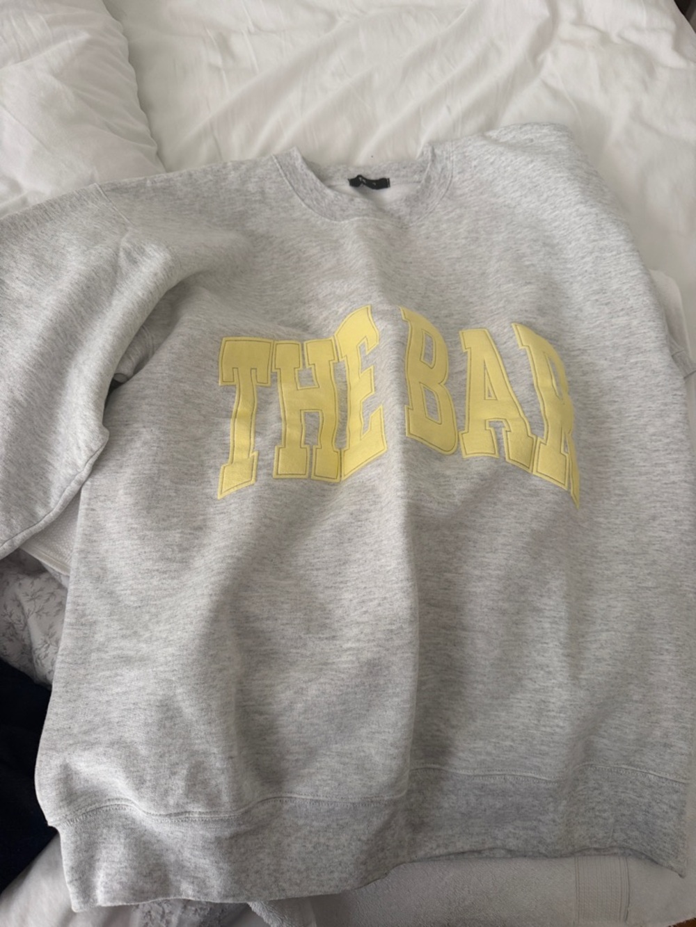 Gray Crewneck Sweatshirt with Yellow 'THE BAY' Graphic